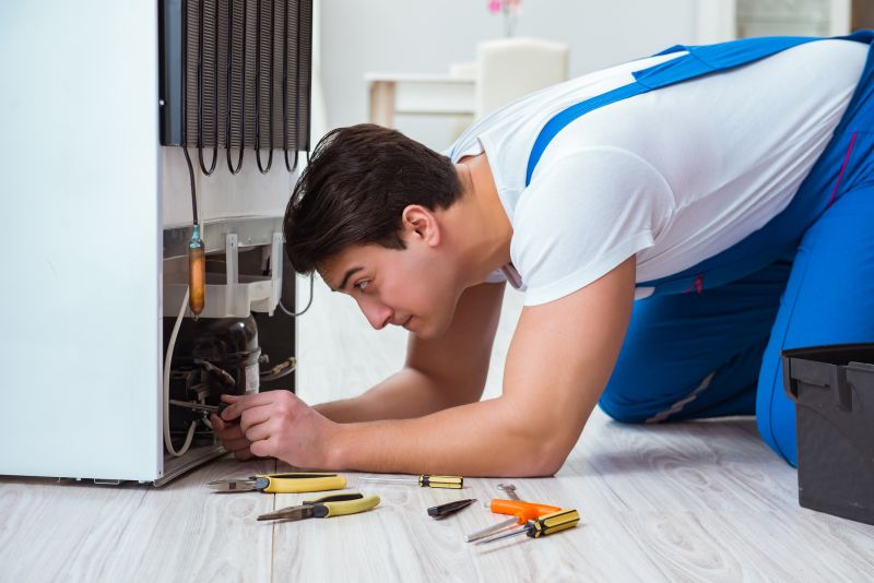 Fridge Repair Technician at Work